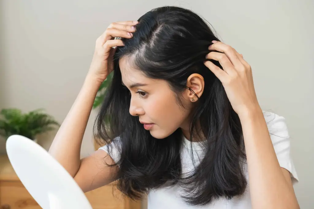 Woman receiving professional hair restoration treatment at Coastal Glo Med Spa in Corpus Christi, TX